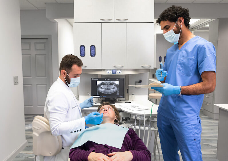 dentist with patient during treatment